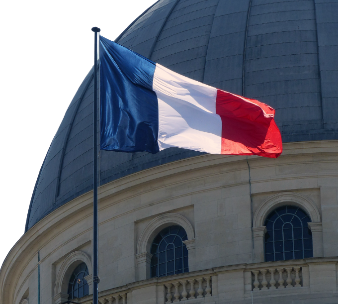 France Flag In Front of Building
